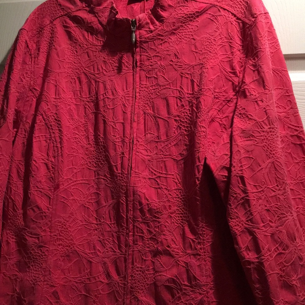 Pink/red long sleeve jacket.
